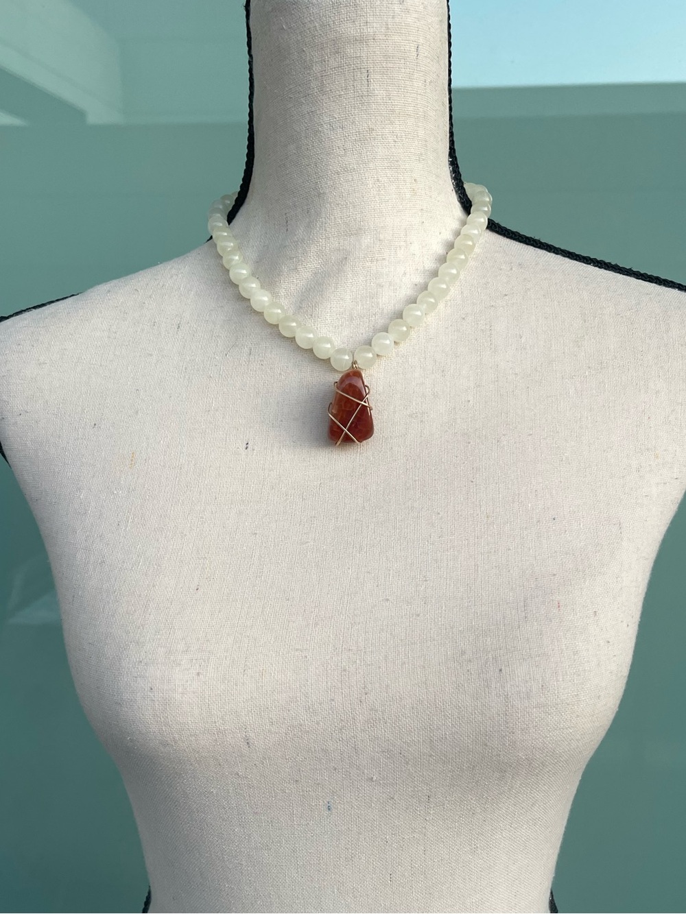 Carnelian Gold Tone Wire Wrapped Pendant on Off White Quartz Beaded Chain